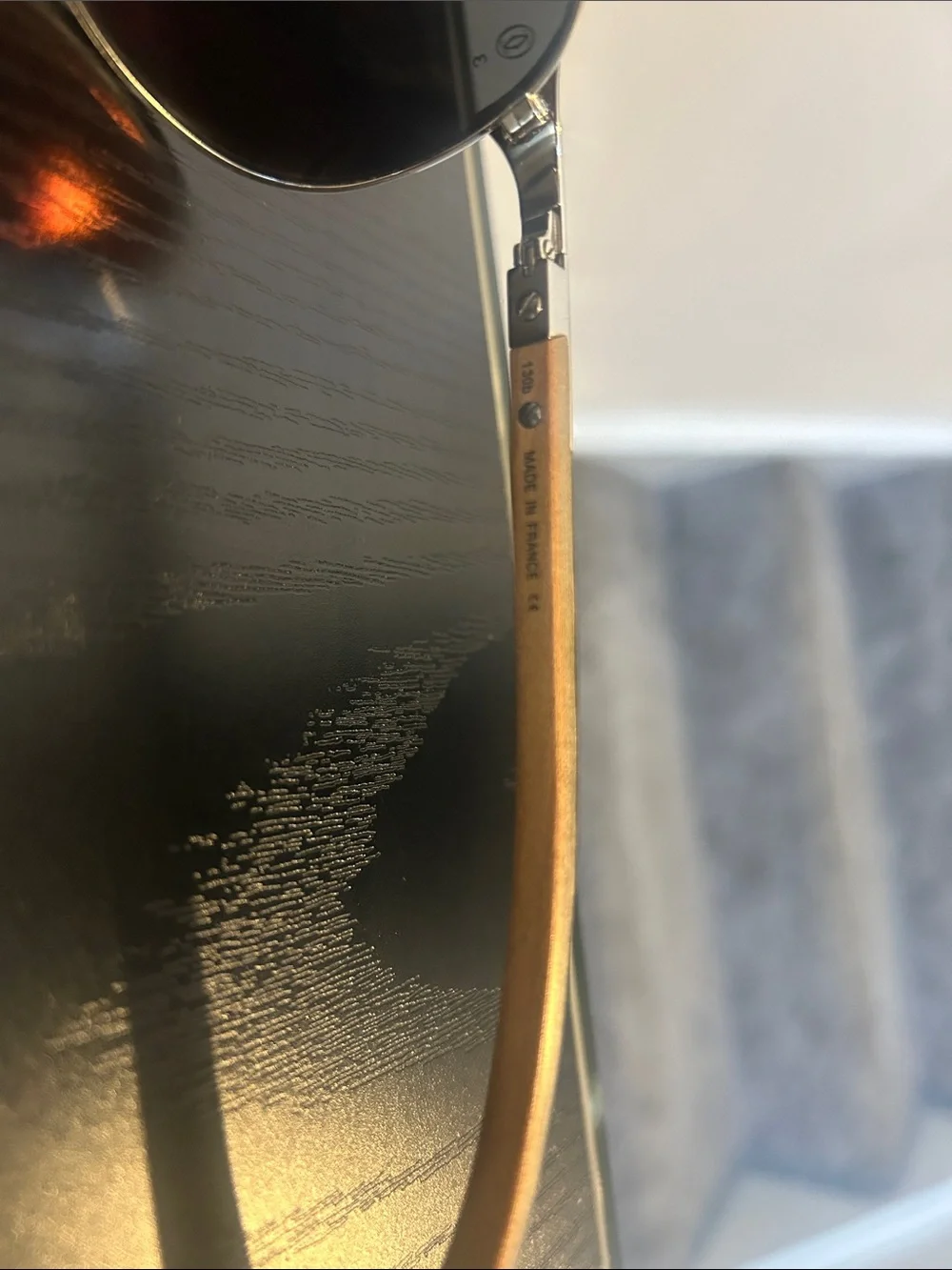 Cartier Silver Frame Sunglasses with Black Lenses and Brown Temples